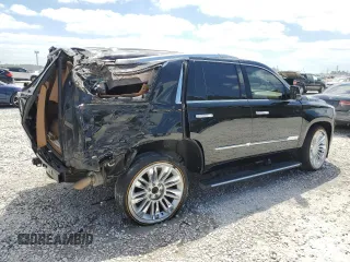 2016 Cadillac Escalade Platinum z VIN 1GYS4DKJ0GR165640, wystawiony jako Copart lot #52453805 z przebiegiem 103 086 mil mil oraz Szkoda całkowita • Salvage title. Historia ofert i sprzedaży dostępna na DreamBid. Obrazek 3.