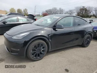 2023 Tesla Model Y Long Range z VIN 7SAYGDEE0PF869710, wystawiony jako Copart lot #52885365 z przebiegiem 13 919 mil mil oraz Szkody całkowita. Historia ofert i sprzedaży dostępna na DreamBid. Obrazek 1.