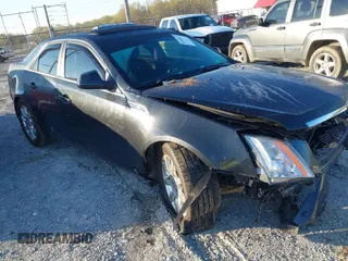 2009 Cadillac CTS RWD w/1SB with VIN 1G6DV57V690129927, listed as a IAAI auction lot 41888670 with 74,156 mi miles. Bid and sale history available at carsss.com. Image 1.
