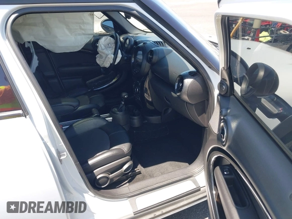 2015 MINI Countryman S with VIN WMWZC3C58FWT05613, listed as a IAAI auction lot 42374870 with 124,214 mi miles and . Bid and sale history available at DreamBid. Image 5.