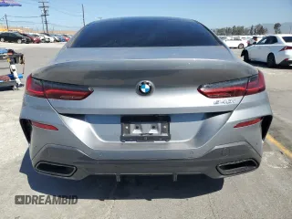 2024 BMW 8 Series 840i with VIN WBAGV2C08RCP97713, listed as a Copart auction lot 57355405 with 14,802 mi miles and Salvage title. Bid and sale history available at DreamBid. Image 6.