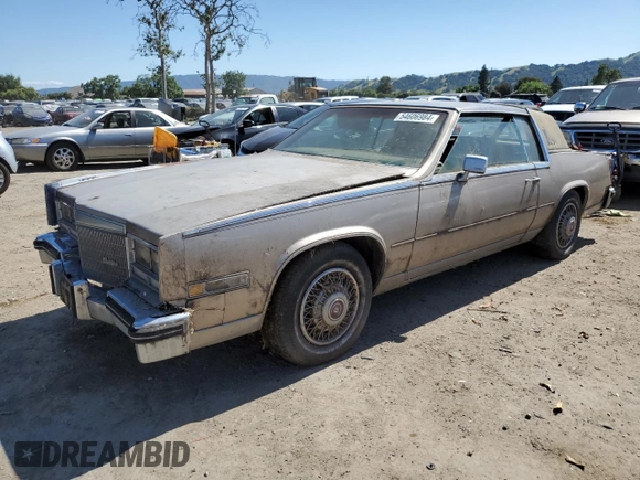 1985 Cadillac Eldorado z VIN 1G6EL578XFE661216, wystawiony jako Copart lot #54606984 z przebiegiem 12 462 mil mil oraz Szkoda całkowita • Salvage title. Historia ofert i sprzedaży dostępna na DreamBid. Obrazek 1.