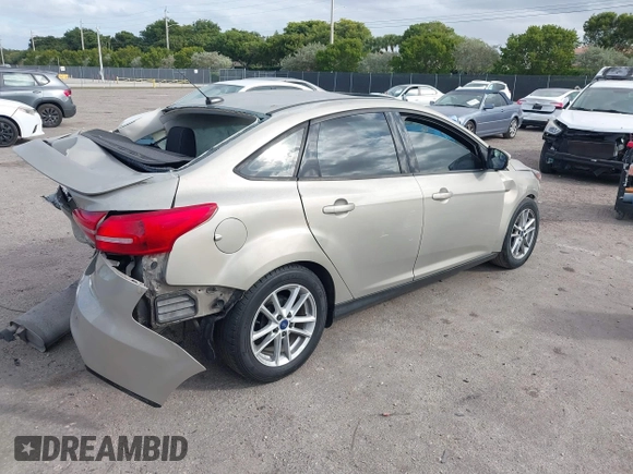2015 Ford Focus SE with VIN 1FADP3F29FL292655, listed as a IAAI auction lot 41090945 with 106,060 mi miles. Bid and sale history available at carsss.com. Image 4.