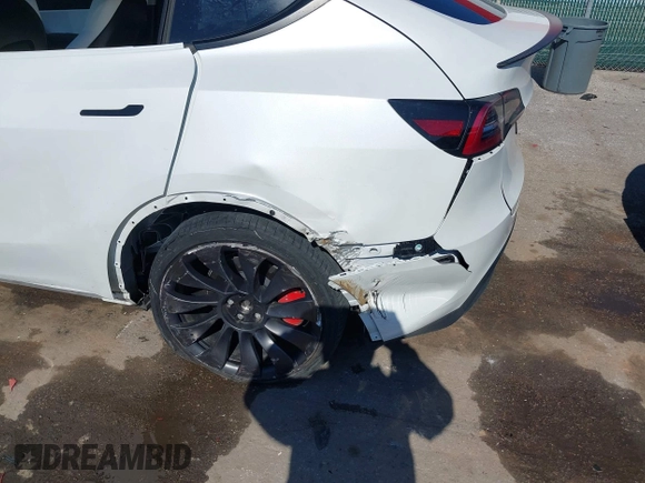 2021 Tesla Model Y Performance with VIN 5YJYGDEF8MF246658, listed as a IAAI auction lot 41679793 with 28,015 mi miles and . Bid and sale history available at DreamBid. Image 20.