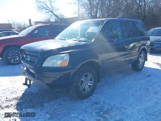 2004 Honda Pilot EX with VIN 2HKYF18544H574133, listed as a IAAI auction lot 41415703 with 217,539 mi miles. Bid and sale history available at carsss.com. Image 2.