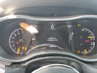 2021 Jeep Grand Cherokee 80th Anniversary with VIN 1C4RJFBG7MC665757, listed as a Copart auction lot 52443235 with 99,828 mi miles and Salvage Title. Bid and sale history available at DreamBid. Image 9.