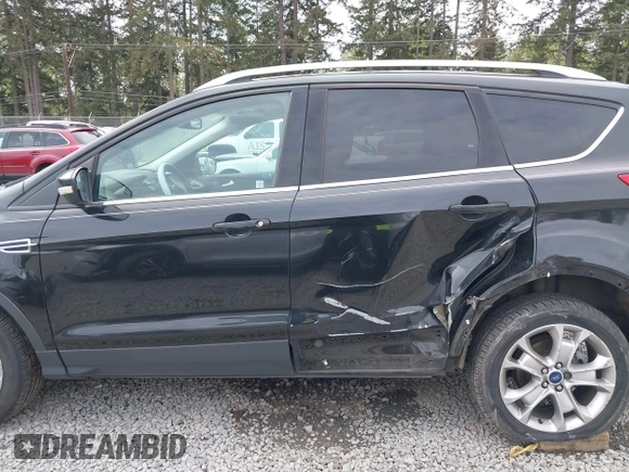 2014 Ford Escape Titanium with VIN 1FMCU9J95EUD60587, listed as a IAAI auction lot 42129854 with 155,559 mi miles and . Bid and sale history available at DreamBid. Image 14.