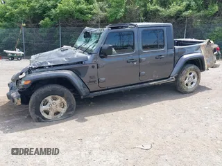 2021 Jeep Gladiator Freedom with VIN 1C6HJTAG3ML557932, listed as a IAAI auction lot 42150245 with 26,656 mi miles and . Bid and sale history available at DreamBid. Image 2.