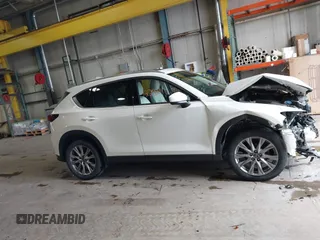 2020 Mazda CX-5 Grand Touring with VIN JM3KFADMXL0742038, listed as a IAAI auction lot 42292400 with 68,339 mi miles and . Bid and sale history available at DreamBid. Image 14.