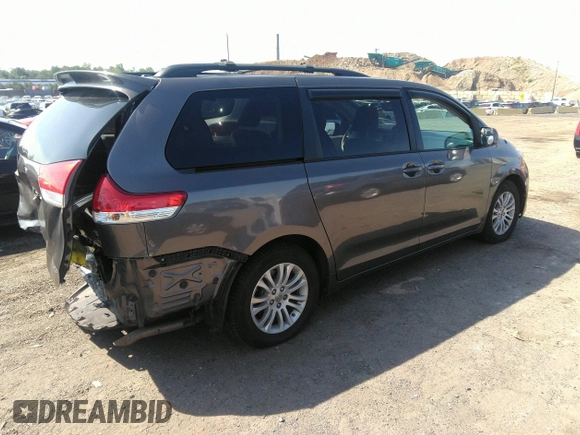 2014 Toyota Sienna XLE with VIN 5TDYK3DC2ES418860, listed as a IAAI auction lot 40139260 with 67,599 mi miles and . Bid and sale history available at DreamBid. Image 4.