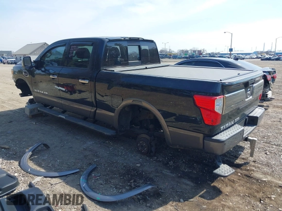 2016 Nissan Titan XD Platinum Reserve with VIN 1N6BA1F27GN506410, listed as a IAAI auction lot 41768621 with 159,404 mi miles. Bid and sale history available at carsss.com. Image 3.