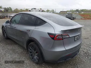 2024 Tesla Model Y Performance with VIN 7SAYGDEF2RA322351, listed as a IAAI auction lot 41953896 with 8,959 mi miles and . Bid and sale history available at carsss.com. Image 3.