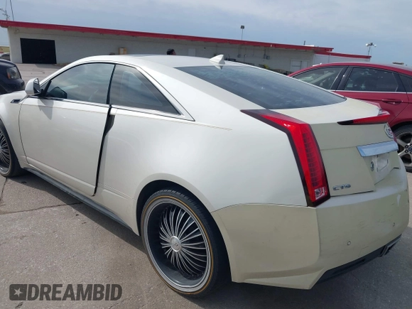 2011 Cadillac CTS Performance with VIN 1G6DJ1ED3B0142767, listed as a IAAI auction lot 41676404 with 238,027 mi miles and . Bid and sale history available at DreamBid. Image 3.