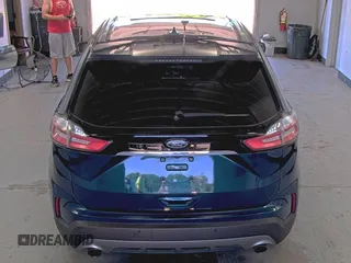 2020 Ford Edge Titanium z VIN 2FMPK3K91LBB37761, wystawiony jako IAAI lot #42829390 z przebiegiem 90 117 mil mil oraz . Historia ofert i sprzedaży dostępna na DreamBid. Obrazek 9.