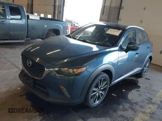 2018 Mazda CX-3 Touring z VIN JM1DKFC78J1323439, wystawiony jako IAAI lot #41725784 z przebiegiem 134 055 mil mil oraz . Historia ofert i sprzedaży dostępna na DreamBid. Obrazek 2.