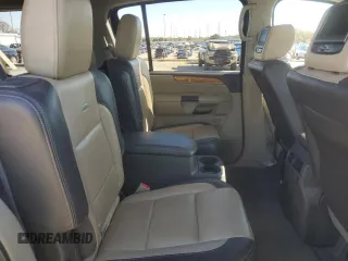 2014 Nissan Armada Platinum z VIN 5N1BA0NF8EN610303, wystawiony jako Copart lot #80653974 z przebiegiem 119 723 mil mil oraz Szkoda całkowita • Salvage title. Historia ofert i sprzedaży dostępna na DreamBid. Obrazek 11.