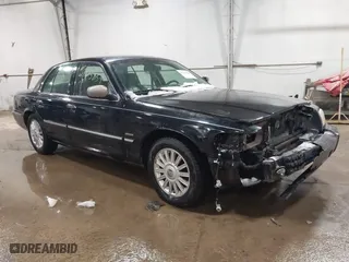 2009 Mercury Grand Marquis LS with VIN 2MEHM75V39X602084, listed as a IAAI auction lot 41615859 with 102,051 mi miles. Bid and sale history available at carsss.com. Image 1.