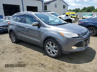2014 Ford Escape Titanium with VIN 1FMCU9J91EUC90702, listed as a Copart auction lot 59116194 with 117,984 mi miles and Salvage Title. Bid and sale history available at DreamBid. Image 4.