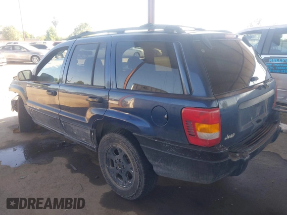 2000 Jeep Grand Cherokee Laredo with VIN 1J4G248SXYC274865, listed as a IAAI auction lot 42542922 with 185,902 mi miles and . Bid and sale history available at DreamBid. Image 3.