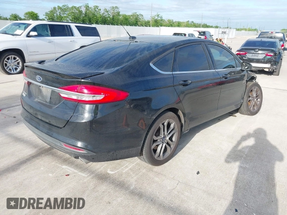 2017 Ford Fusion S with VIN 3FA6P0G75HR353909, listed as a IAAI auction lot 42024272 with 151,383 mi miles. Bid and sale history available at carsss.com. Image 4.