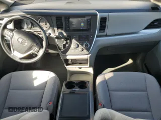 2015 Toyota Sienna LE with VIN 5TDJK3DC2FS126466, listed as a Copart auction lot 61165105 with 56,634 mi miles and Salvage title. Bid and sale history available at DreamBid. Image 8.
