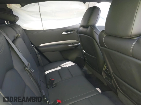 2021 Cadillac XT4 FWD Premium Luxury z VIN 1GYFZCR48MF004849, wystawiony jako IAAI lot #42131896 z przebiegiem 9 864 mil mil oraz . Historia ofert i sprzedaży dostępna na DreamBid. Obrazek 8.