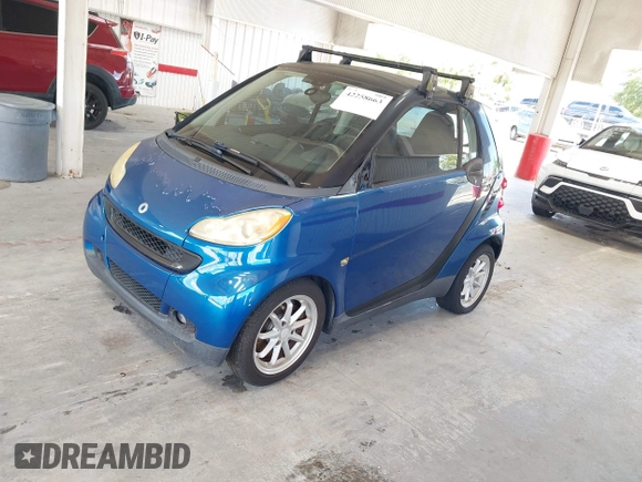 2008 Smart fortwo Pure with VIN WMEEJ31X28K123879, listed as a IAAI auction lot 42258663 with 93,056 mi miles and . Bid and sale history available at DreamBid. Image 2.