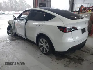 2023 Tesla Model Y Long Range z VIN 7SAYGAEEXPF789037, wystawiony jako IAAI lot #41551605 z przebiegiem 8 630 mil mil oraz . Historia ofert i sprzedaży dostępna na DreamBid. Obrazek 3.