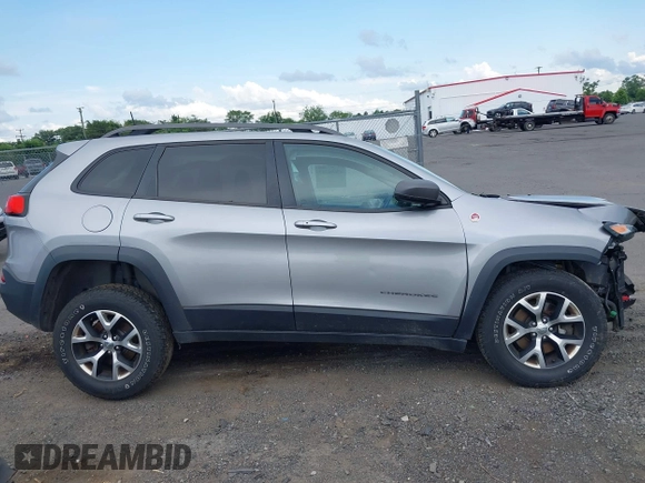 2017 Jeep Cherokee Trailhawk z VIN 1C4PJMBB8HW565462, wystawiony jako IAAI lot #42696507 z przebiegiem 114 819 mil mil oraz . Historia ofert i sprzedaży dostępna na DreamBid. Obrazek 13.