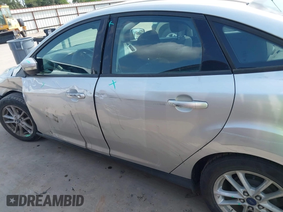 2015 Ford Focus SE z VIN 1FADP3F21FL348863, wystawiony jako IAAI lot #42401820 z przebiegiem 126 329 mil mil oraz . Historia ofert i sprzedaży dostępna na DreamBid. Obrazek 14.