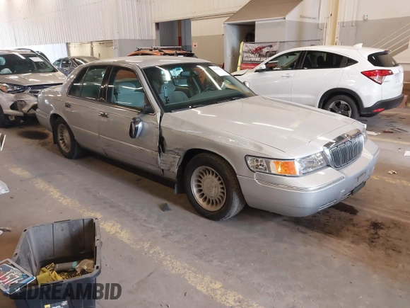 2000 Mercury Grand Marquis LS z VIN 2MEFM75W0YX736324, wystawiony jako IAAI lot #41865927 z przebiegiem 136 886 mil mil oraz . Historia ofert i sprzedaży dostępna na DreamBid. Obrazek 1.