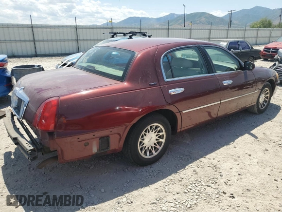 2000 Lincoln Town Car Signature with VIN 1LNHM82W2YY809189, listed as a Copart auction lot 59812665 with 148,236 mi miles and Salvage title. Bid and sale history available at DreamBid. Image 3.