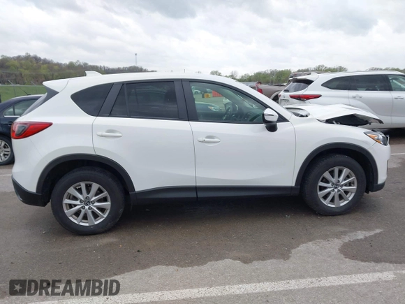 2015 Mazda CX-5 Touring with VIN JM3KE2CY3F0550624, listed as a IAAI auction lot 41931268 with 51,588 mi miles and . Bid and sale history available at carsss.com. Image 13.