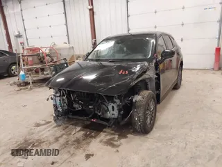 2021 Mazda CX-5 Touring with VIN JM3KFBCM1M1380409, listed as a IAAI auction lot 41677537 with 55,319 mi miles. Bid and sale history available at carsss.com. Image 6.