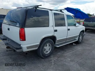 1995 Chevrolet Tahoe with VIN 1GNEC13K9SJ414611, listed as a IAAI auction lot 42798752 with 205,988 mi miles and . Bid and sale history available at DreamBid. Image 4.