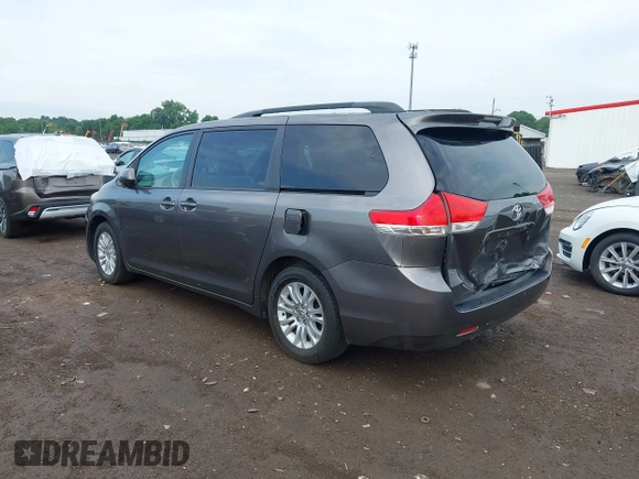 2014 Toyota Sienna XLE with VIN 5TDYK3DC0ES496716, listed as a IAAI auction lot 42494549 with 158,645 mi miles and . Bid and sale history available at DreamBid. Image 3.