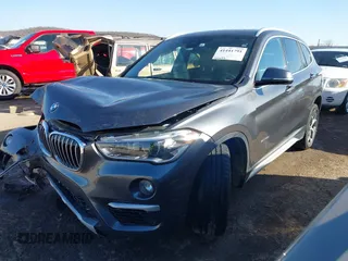 2017 BMW X1 sDrive28i with VIN WBXHU7C30H5H32753, listed as a IAAI auction lot 41441791 with 100,072 mi miles. Bid and sale history available at carsss.com. Image 2.