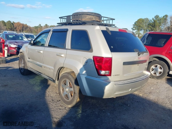 2007 Jeep Grand Cherokee Laredo with VIN 1J8GS48K07C630303, listed as a IAAI auction lot 40993022 with 254,294 mi miles. Bid and sale history available at carsss.com. Image 3.