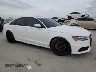 2015 Audi A6 3.0T Prestige with VIN WAUHGAFCXFN031884, listed as a Copart auction lot 41890843 with 136,077 mi miles. Bid and sale history available at carsss.com. Image 4.