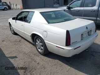 2000 Cadillac Eldorado Touring ETC z VIN 1G6ET129XYU162451, wystawiony jako IAAI lot #42412406 z przebiegiem 89 413 mil mil oraz . Historia ofert i sprzedaży dostępna na DreamBid. Obrazek 3.