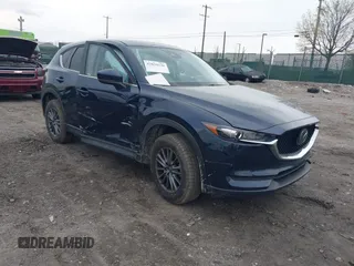 2021 Mazda CX-5 Touring with VIN JM3KFBCM1M1336457, listed as a IAAI auction lot 42034330 with 39,910 mi miles. Bid and sale history available at carsss.com. Image 1.