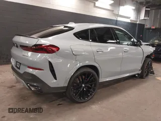 2025 BMW X6 xDrive40i with VIN 5UX33EX04S9Z44291, listed as a IAAI auction lot 41827897 with 1,053 mi miles. Bid and sale history available at carsss.com. Image 4.