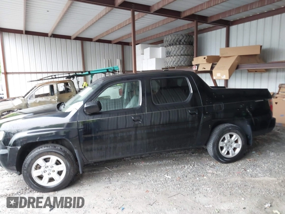 2007 Honda Ridgeline RTL with VIN 2HJYK16547H549241, listed as a IAAI auction lot 42282477 with 214,685 mi miles and . Bid and sale history available at DreamBid. Image 14.