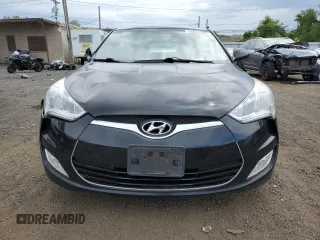 2013 Hyundai Veloster w/Gray Int z VIN KMHTC6AD9DU110094, wystawiony jako Copart lot #64660645 z przebiegiem 149 746 mil mil oraz Szkoda całkowita • Salvage title. Historia ofert i sprzedaży dostępna na DreamBid. Obrazek 5.