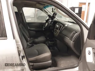 2003 Mazda Tribute DX with VIN 4F2YZ02B73KM43813, listed as a IAAI auction lot 41575708 with 202,214 mi miles and . Bid and sale history available at carsss.com. Image 5.