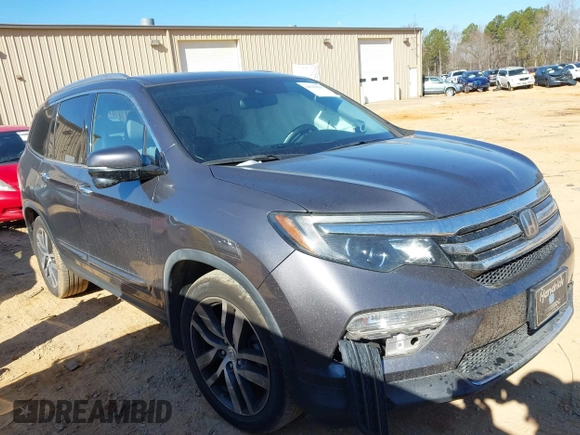 2017 Honda Pilot Touring with VIN 5FNYF5H92HB038893, listed as a IAAI auction lot 41639555 with 100,354 mi miles. Bid and sale history available at carsss.com. Image 1.