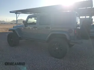 2014 Jeep Wrangler Unlimited Rubicon with VIN 1C4HJWFG9EL199501, listed as a Copart auction lot 61443595 with 86,940 mi miles and Salvage title. Bid and sale history available at DreamBid. Image 2.