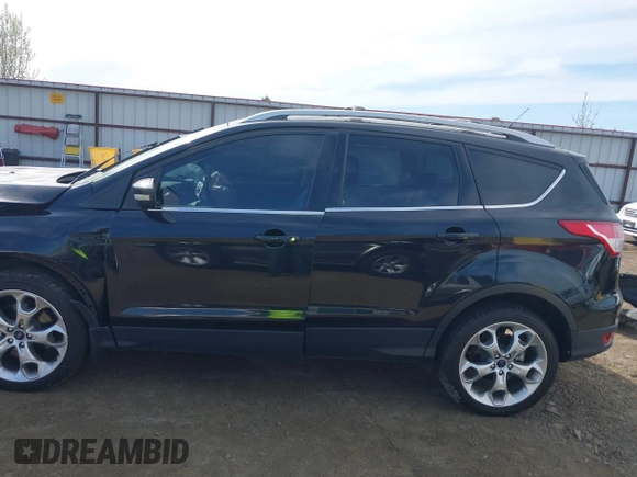 2014 Ford Escape Titanium with VIN 1FMCU9J93EUE27803, listed as a IAAI auction lot 42028249 with 131,194 mi miles and . Bid and sale history available at DreamBid. Image 13.