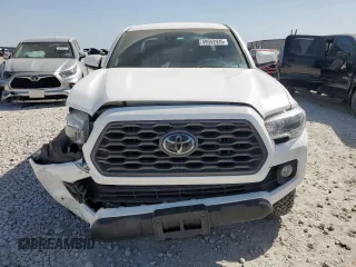 2021 Toyota Tacoma SR z VIN 3TMCZ5AN8MM387166, wystawiony jako Copart lot #49952935 z przebiegiem 63 175 mil mil oraz Szkoda całkowita • Salvage title. Historia ofert i sprzedaży dostępna na DreamBid. Obrazek 5.