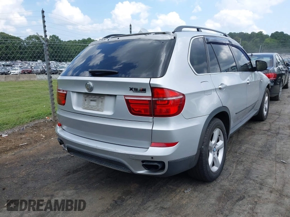 2011 BMW X5 50i with VIN 5UXZV8C55BL419654, listed as a IAAI auction lot 42752609 with 204,677 mi miles and . Bid and sale history available at DreamBid. Image 4.